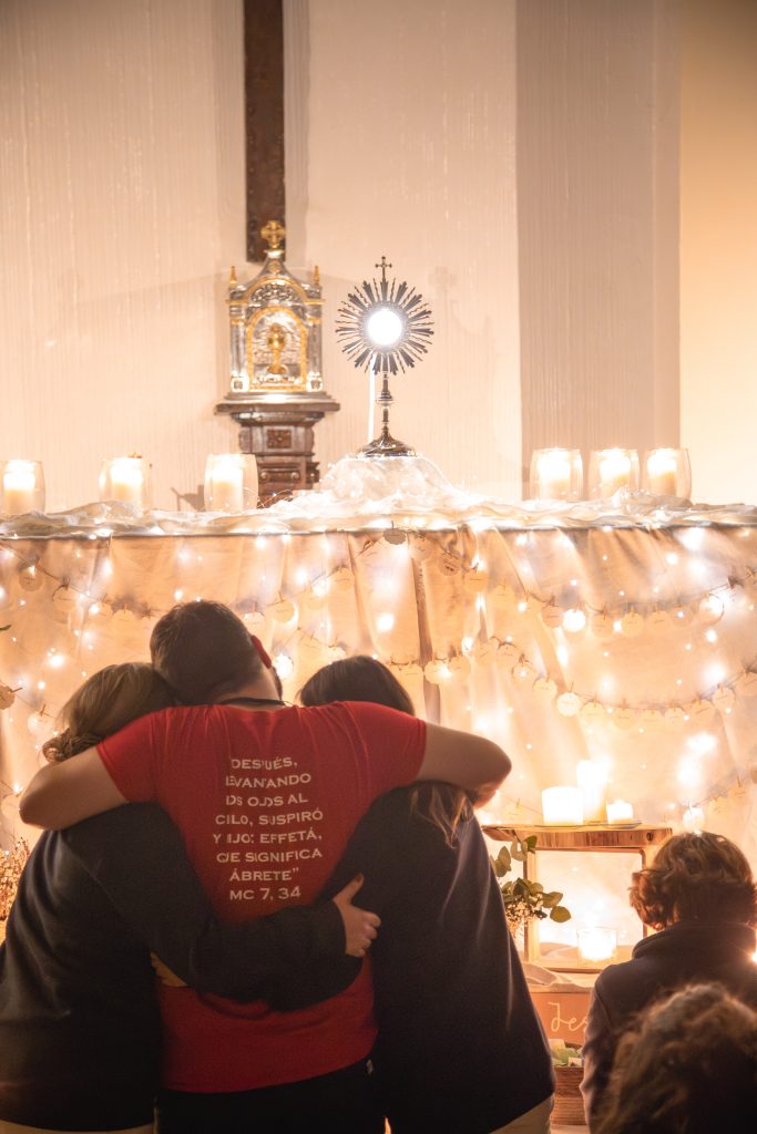 family in front of St Sacrament